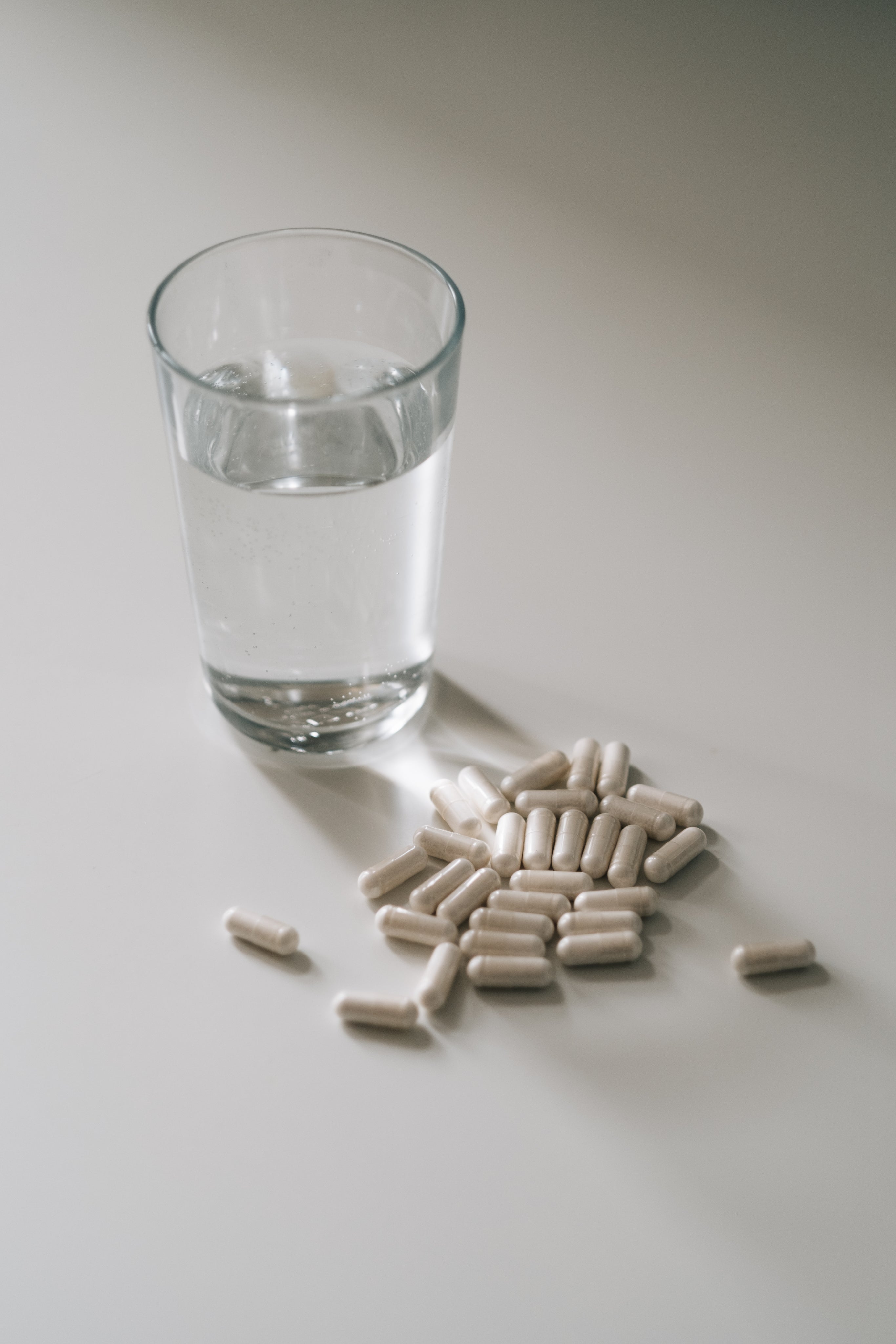 glass-of-water-and-a-pile-of-white-pills.jpg